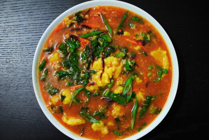 Tomato, artichoke drop soup with rice, kale, and carrots. Tomato, artichoke drop soup with rice, kale, and carrots.