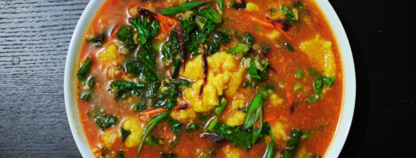 Tomato, artichoke drop soup with rice, kale, and carrots.