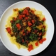 Pepper, tomato and onion stew (lecsó) with black lentils and kale